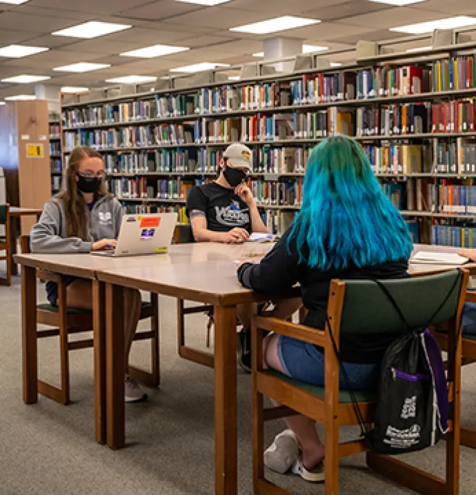 UNI students study with masks on in Rod Library.