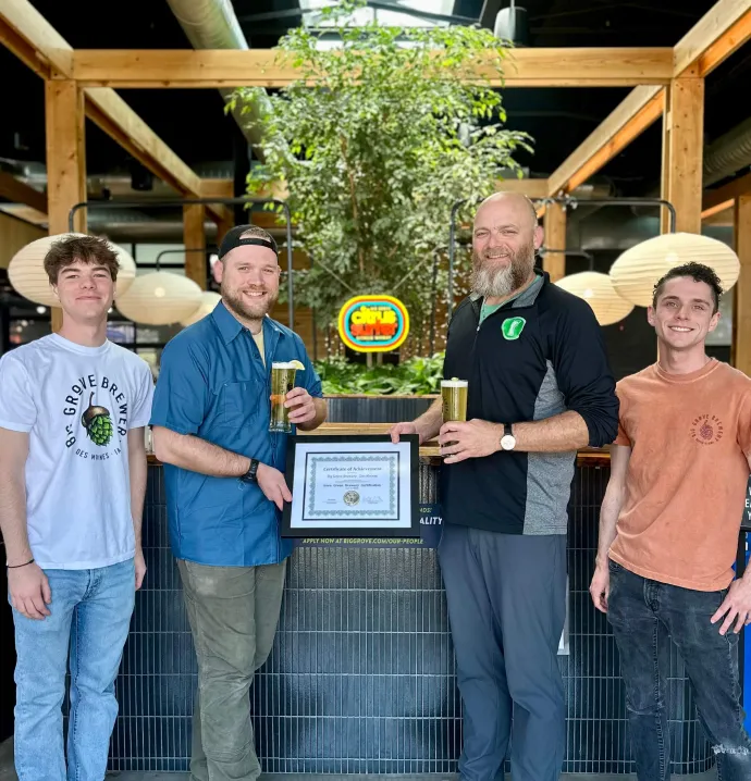Big Grove Des Moines staff members accept their Iowa Green Brewery Certification