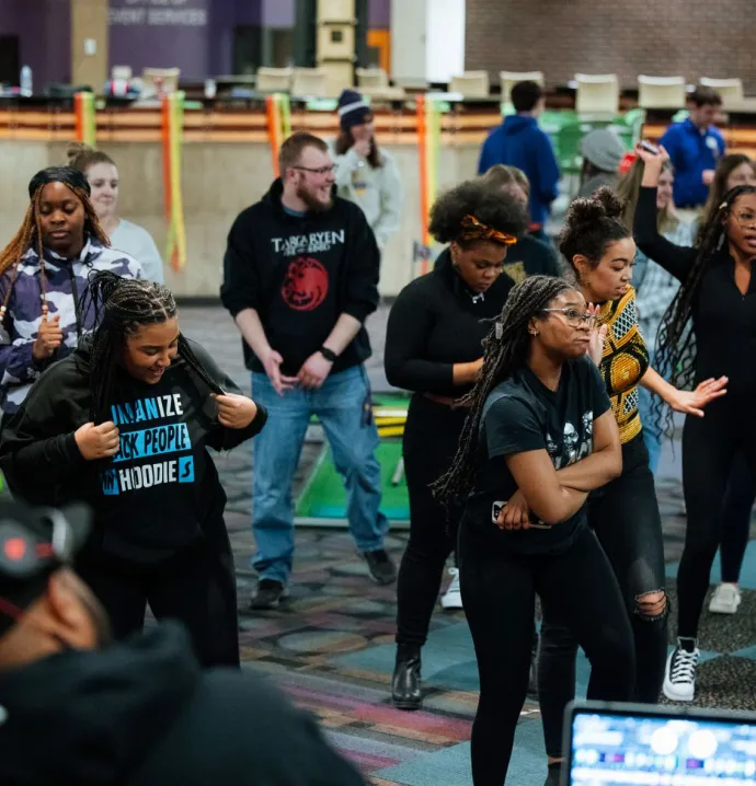 People dance at the Black History Month kickoff