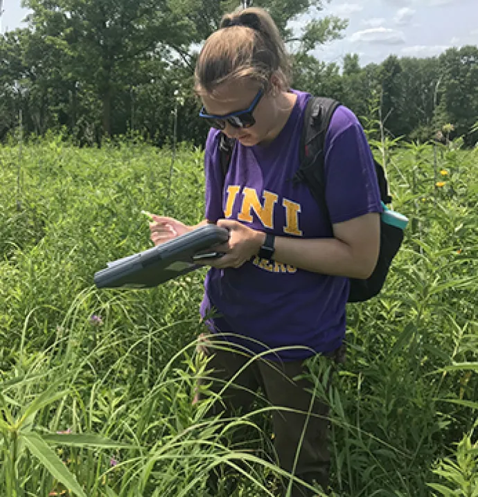 UNI students in the field studying monarch butterfly habitat.