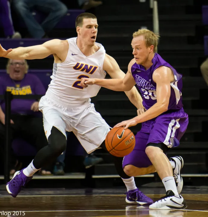 Klint Carlson in UNI uniform playing basketball