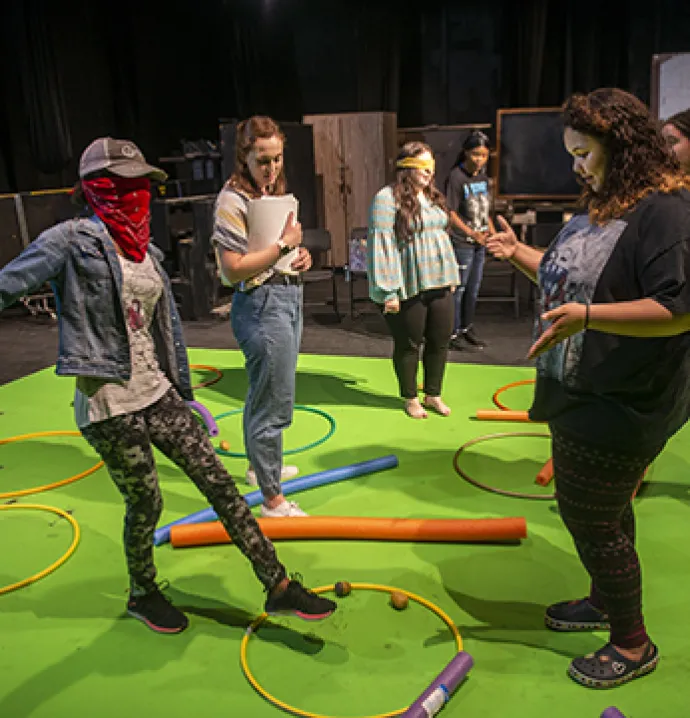 Students participate in a theatre workshop at UNI.