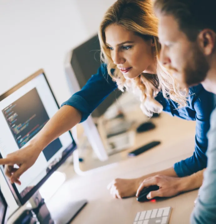 Man and woman working at computers