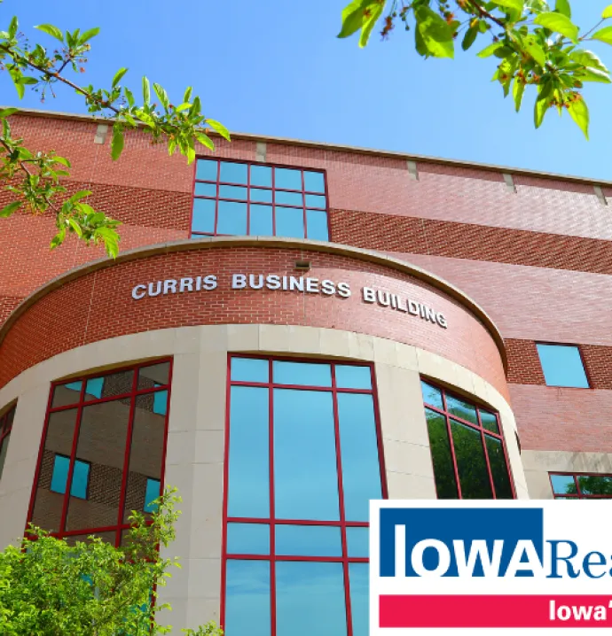 Curris Business Building with Iowa Realty logo