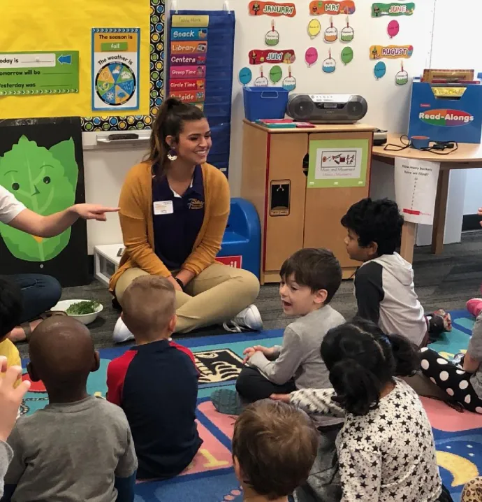 Public health majors introducing students to fresh produce