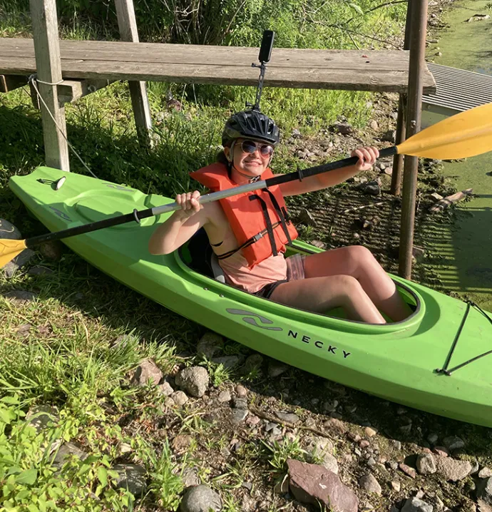 UNI senior Lindsey Hubbell in a kayak.