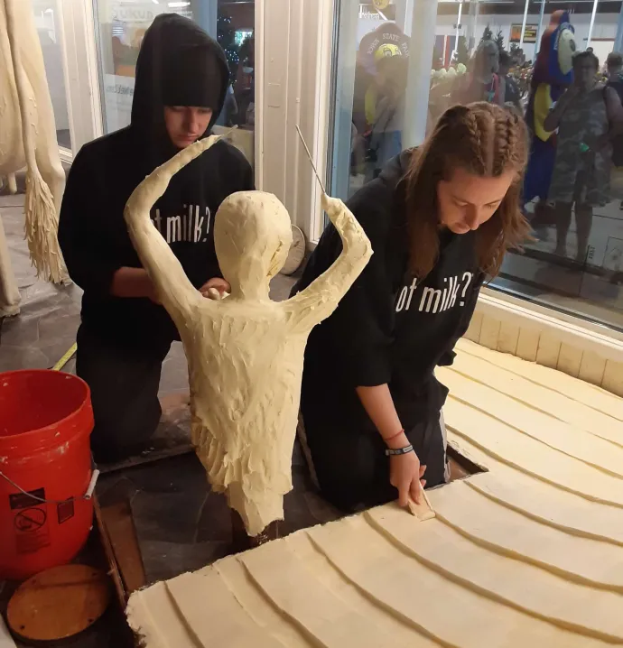Hannah and Grace Pratt sculpting butter slide