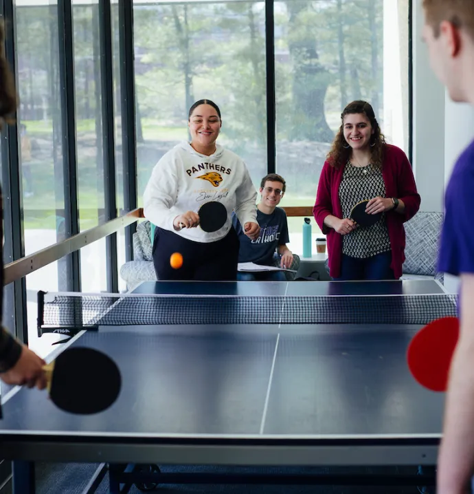 Students playing pingpong in residence hall