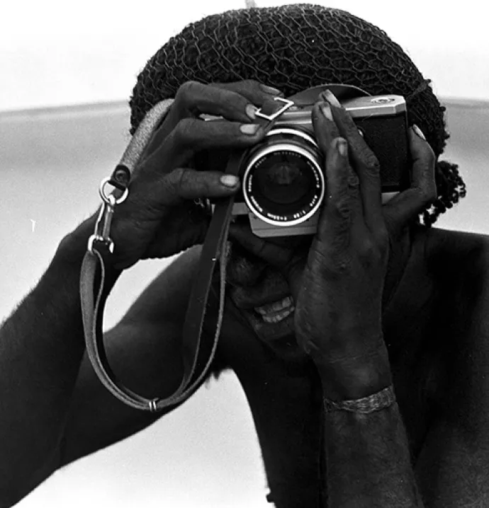 Indigenous individual with a camera