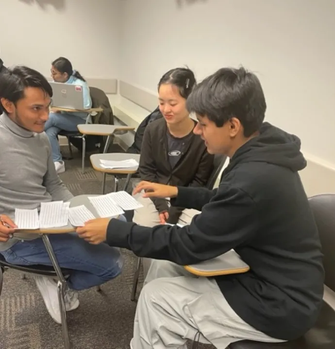 Students going over notes in a classroom