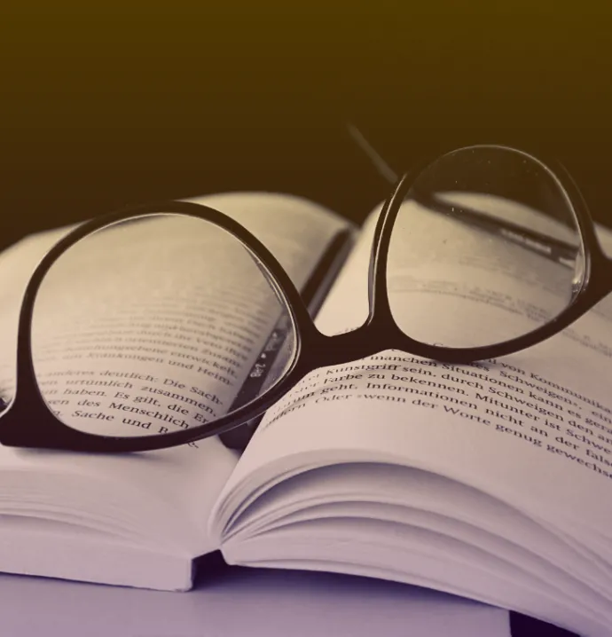 glasses on open book