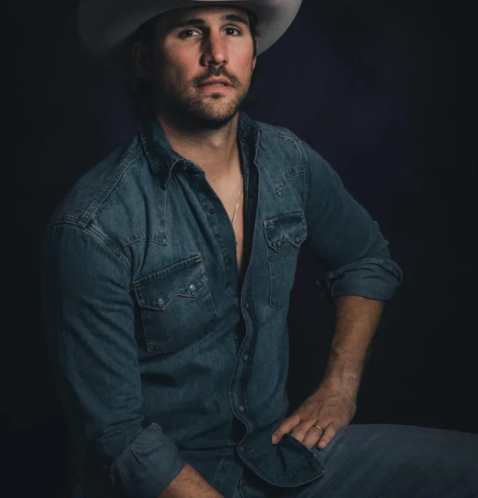Justin Adams in a cowboy hat