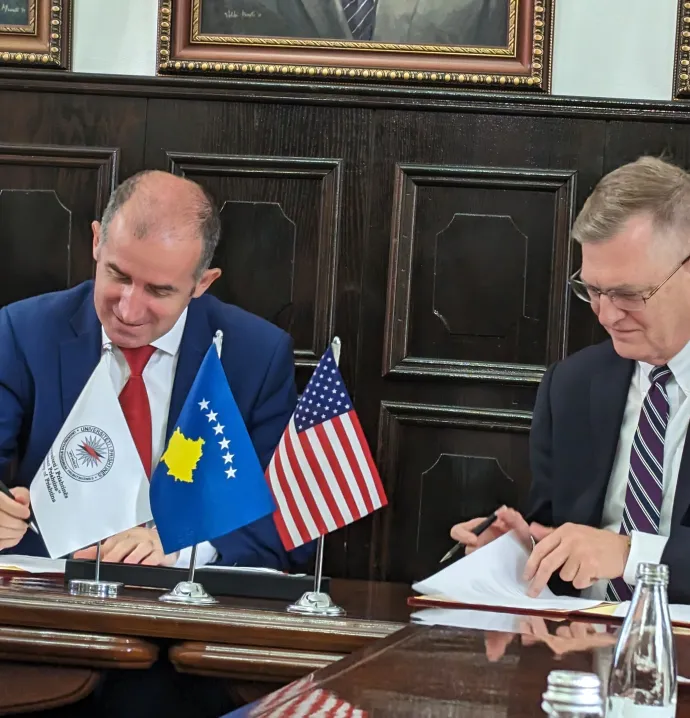 President Nook and President of University of Prishtina signing memorandum of understanding
