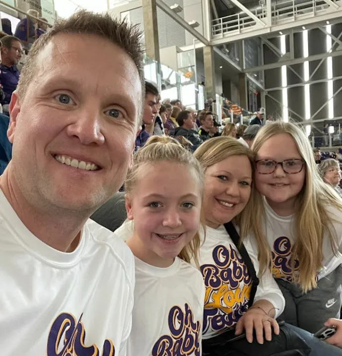 UNI Alumni Association president Brian Gabel and his family in the McLeod Center