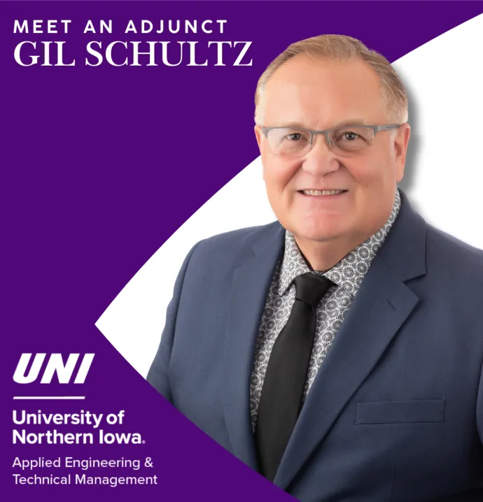 Man in suit smiling for photo with a purple and white background