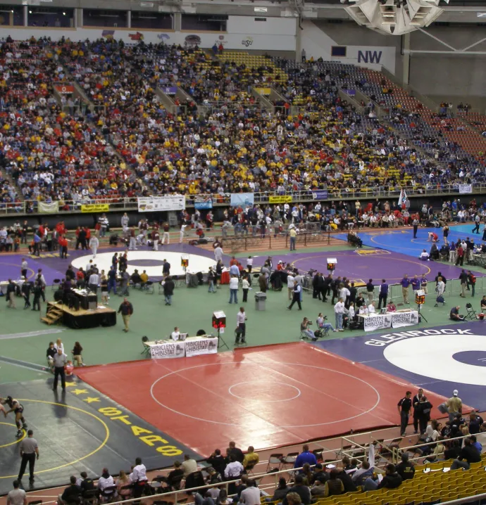 Inside UNI-Dome while wrestlers are dualling