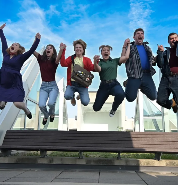 Ordinary Days cast jumping in the air