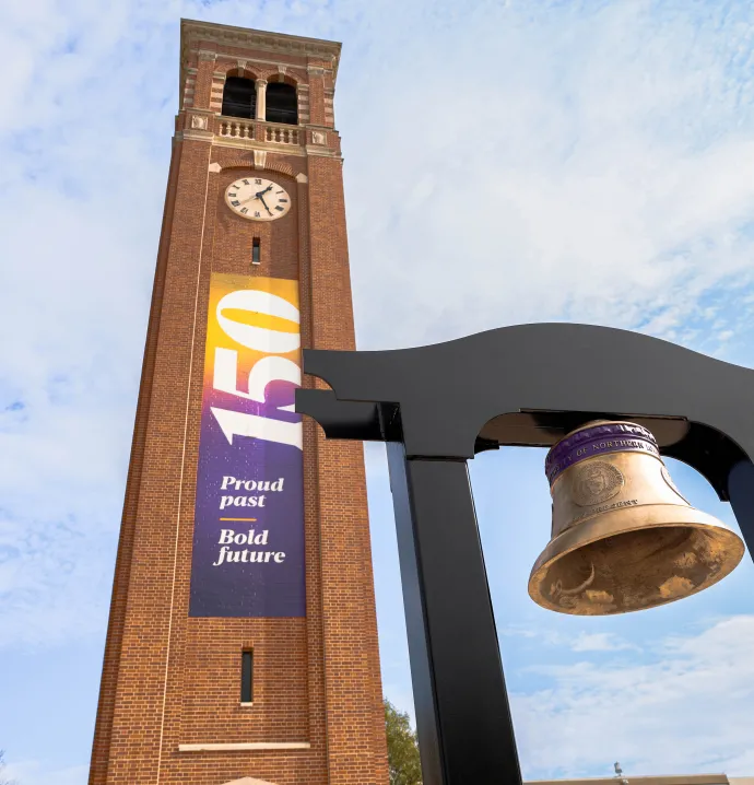 Sesquicentennial Bell underneath UNI Campanile