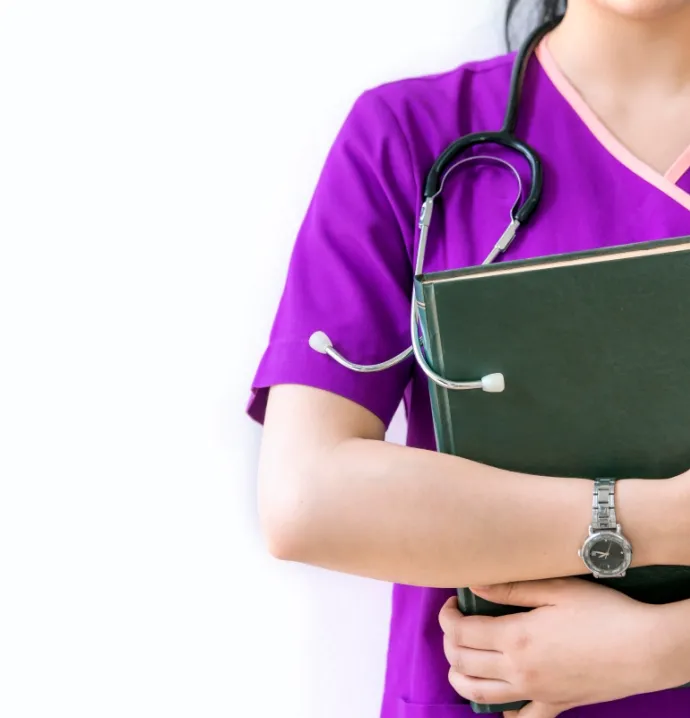Woman wearing purple scrubs