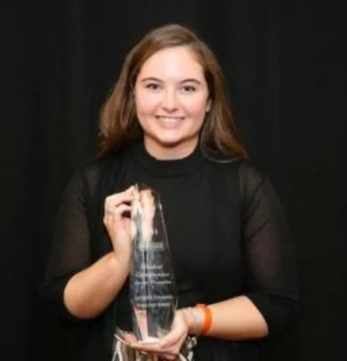 Sami with Student Entrepreneur of the Year award. 