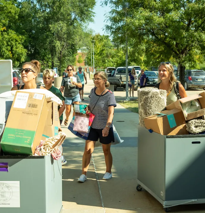 Students move in to the dorms on UNI campus with the help of their families