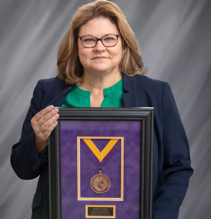 Shelley O'Connell holding her Presidential Medallion