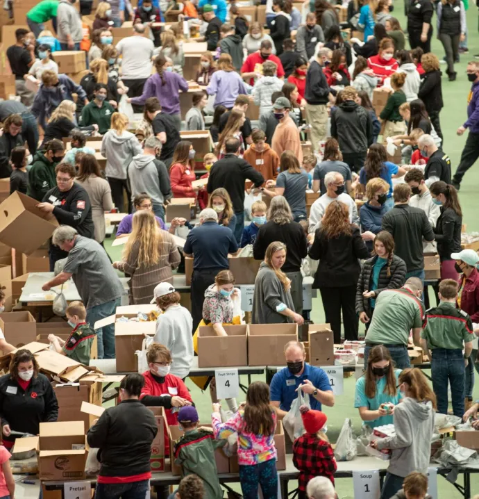 Volunteers work together to pack the Dome