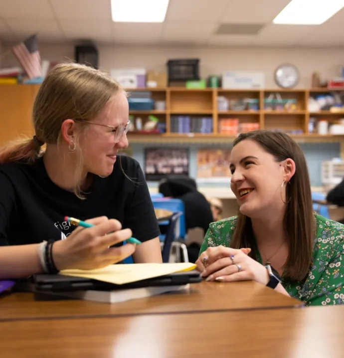 College student helping younger student