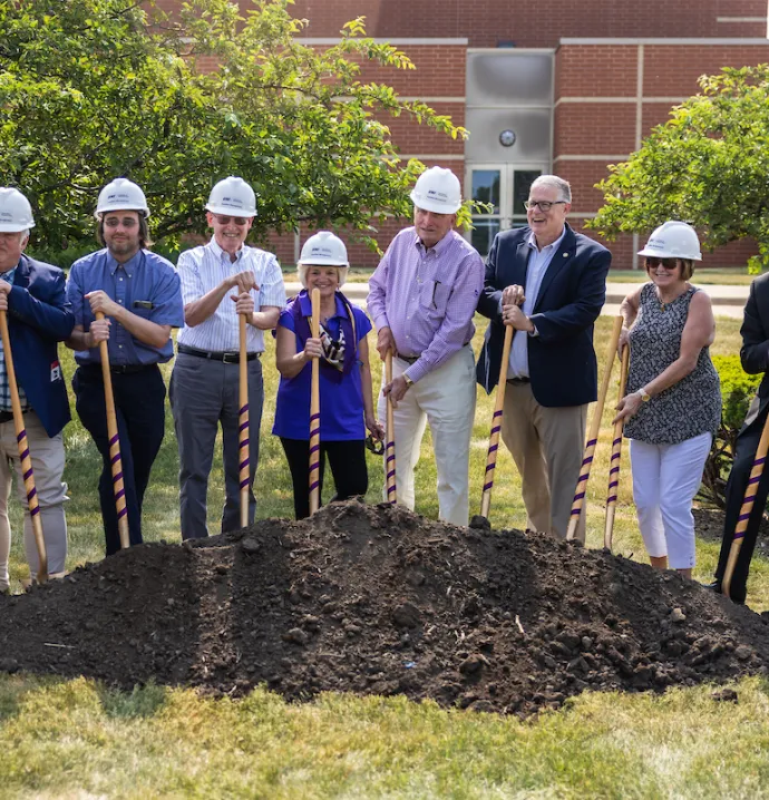 Eight individuals break ground on GBPAC renovation and expansion with shovels