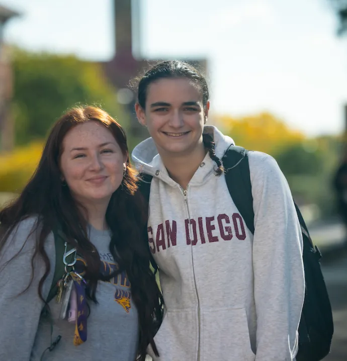 Two students smiling on UNI campus