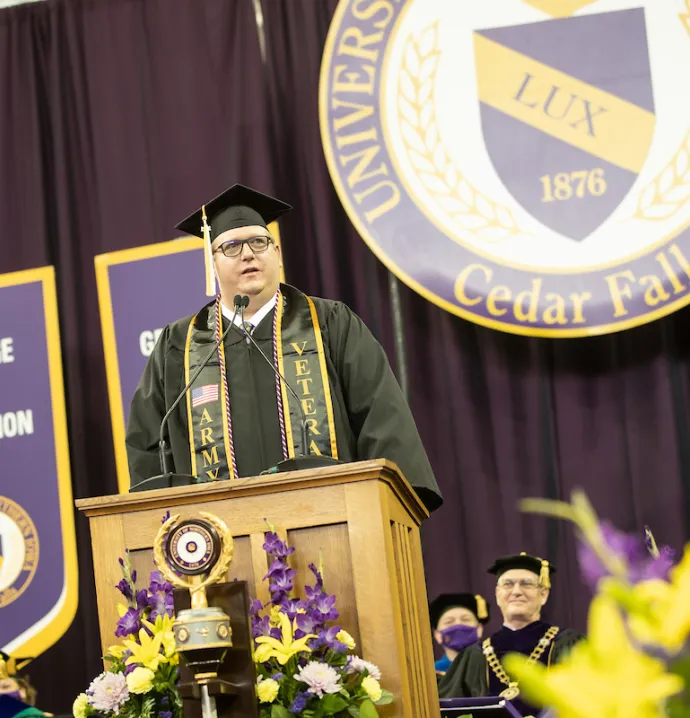 Caleb Christine gives a speech during the December 2021 Commencement Ceremony