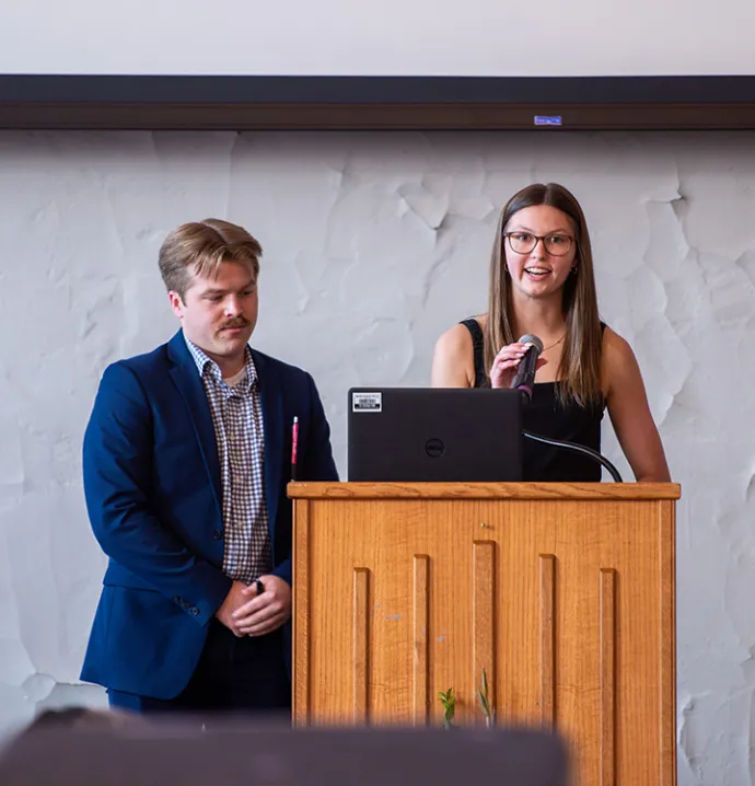 Wilson Presidents' Council Co-Presidents Grace Croat and Nathanial Madden emceeing Leadership Celebration.