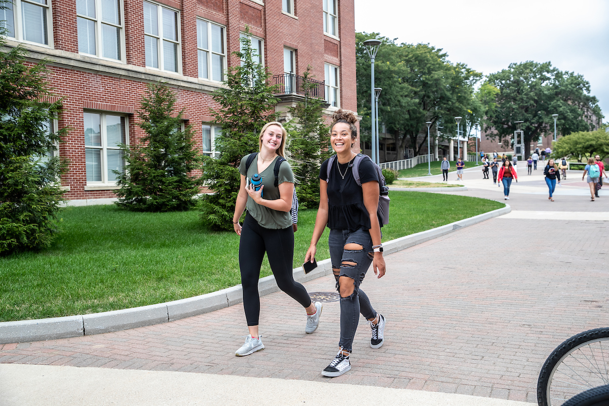 Three students walking on UNI campus