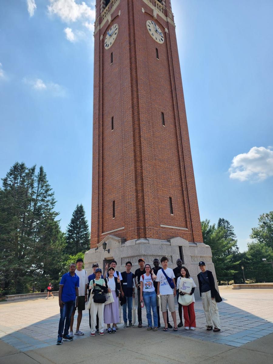 Students from the University of Yamanashi standing in front of the Campanile